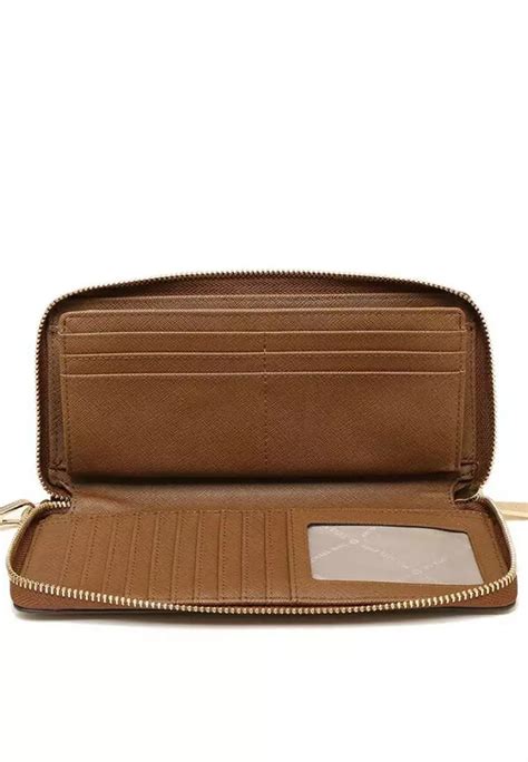 Jet Set Travel Large Pebbled Leather Wristlet .